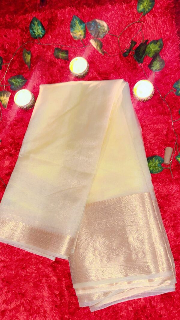 organza saree Fabric : Organza color : cream color Embroidery : zari border
